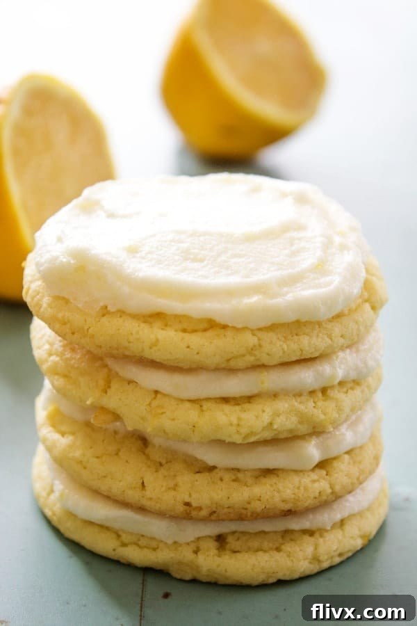 Soft and chewy lemon sugar cookies, dusted with powdered sugar.