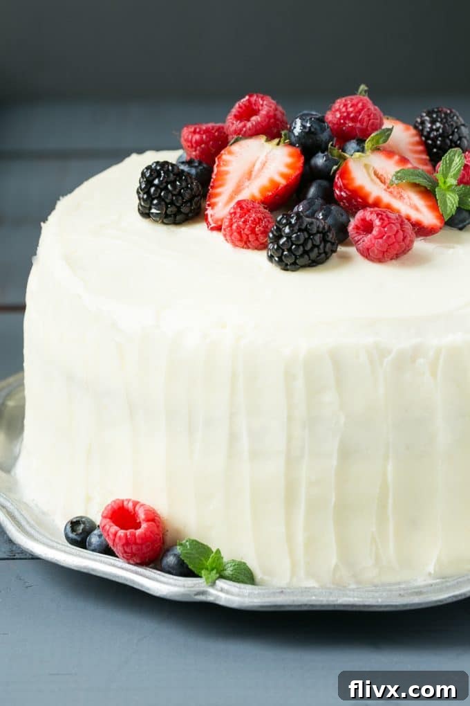 A magnificent berry chantilly cake with fresh berries and fluffy frosting.