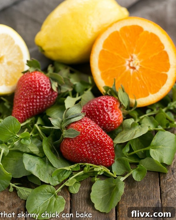 A vibrant display of fresh ingredients for Salmon Watercress Salad on a rustic wooden board.