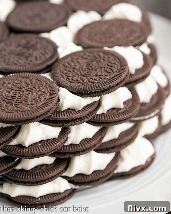 Close view of oreo icebox cake recipe on a white plate, highlighting the delicious layers.