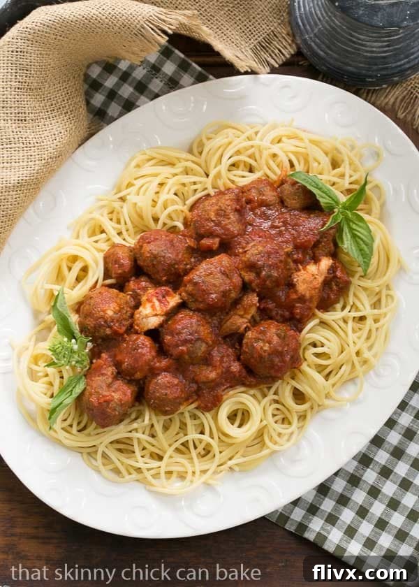 Slowly simmered Sunday gravy made the Italian way, showcasing the deep red color and texture of the sauce.