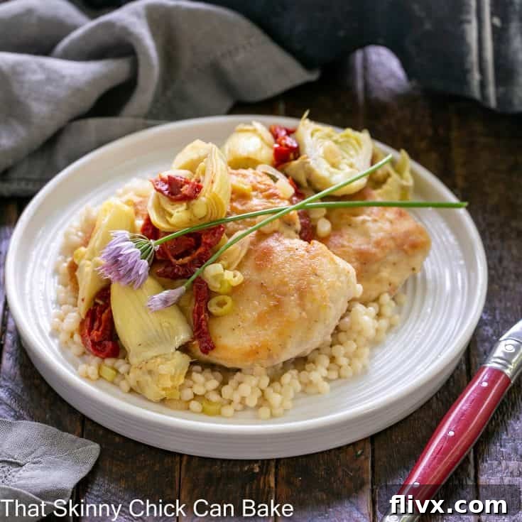 Delicious skillet chicken with artichokes and Israeli couscous on a plate