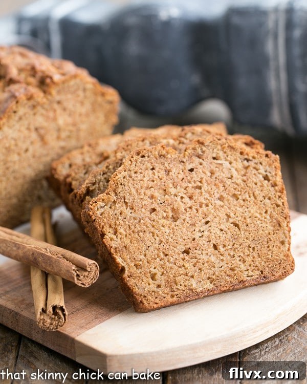 Deliciously moist Brown Sugar Apple Bread Recipe on a rustic wooden board, ready to be sliced and enjoyed.