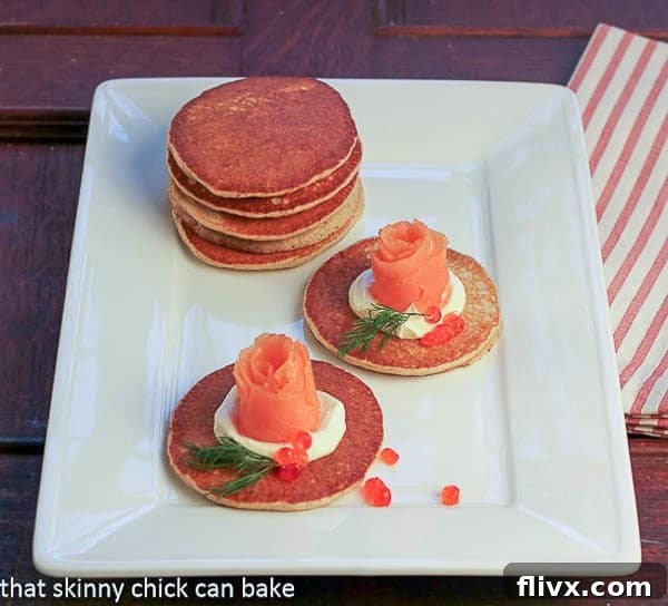 Buckwheat Blini with Smoked Salmon Roses on a white platter
