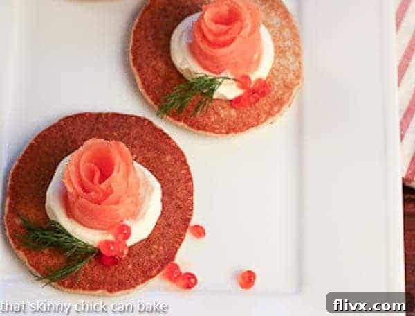 Overhead view of 2 Buckwheat Blini with Smoked Salmon Roses