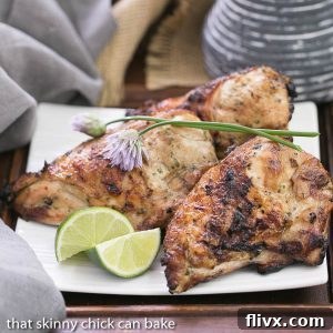 Grilled Thai chicken breasts with a vibrant green herb garnish, showcasing a delicious marinade.