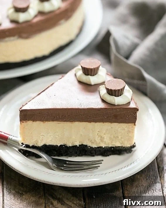 A slice of Chocolate Peanut Butter Pie on a white dessert plate with a red handled fork.