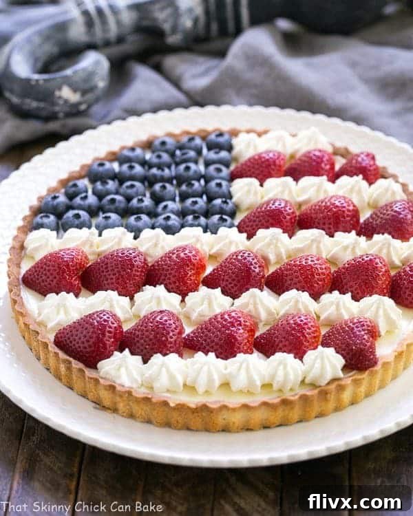 American Flag Fruit Tart on a white serving plate.