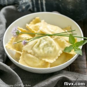 A beautifully arranged serving of Mozzarella, Basil, Parmigiano-Reggiano Ravioli with Butter Sage Sauce, ready to be enjoyed.