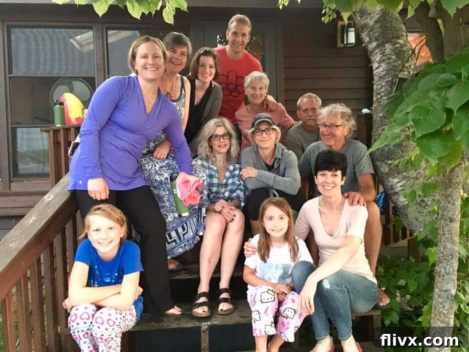 A joyous group photo of family members, including sisters and Greenwood relatives, smiling together, symbolizing the happy memories made during the Northern Minnesota reunion that inspired the Watermelon Feta Basil Salad.