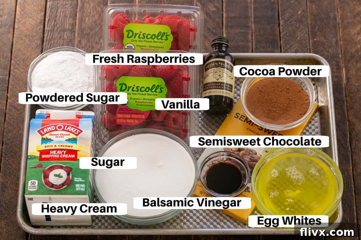 All the ingredients for Chocolate Pavlova laid out on a metal sheet pan, clearly labeled for easy identification.