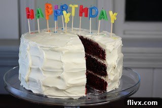 A piece of cake removed from a 3 layer red velvet cake