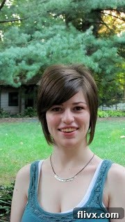 Katie in a blue shirt in the backyard