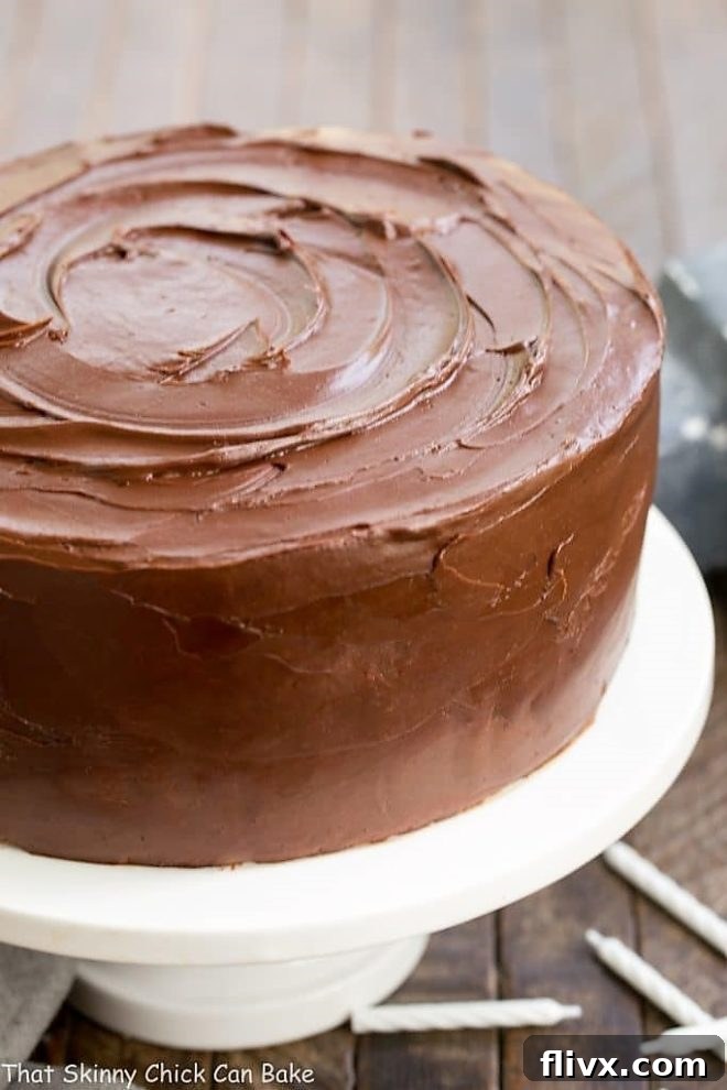 Classic Yellow Butter Cake with Chocolate Icing on a cake platter