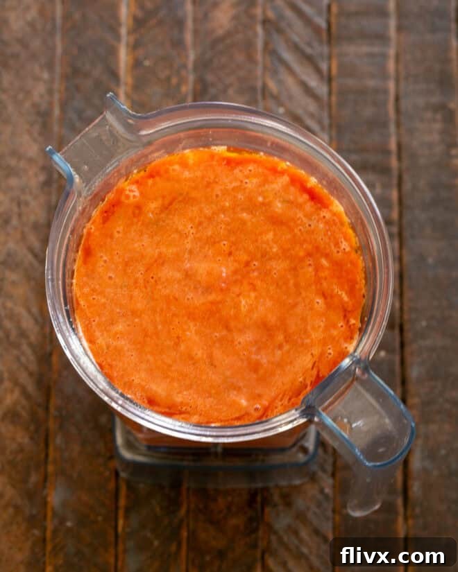 Gazpacho chilling in a bowl in the refrigerator.
