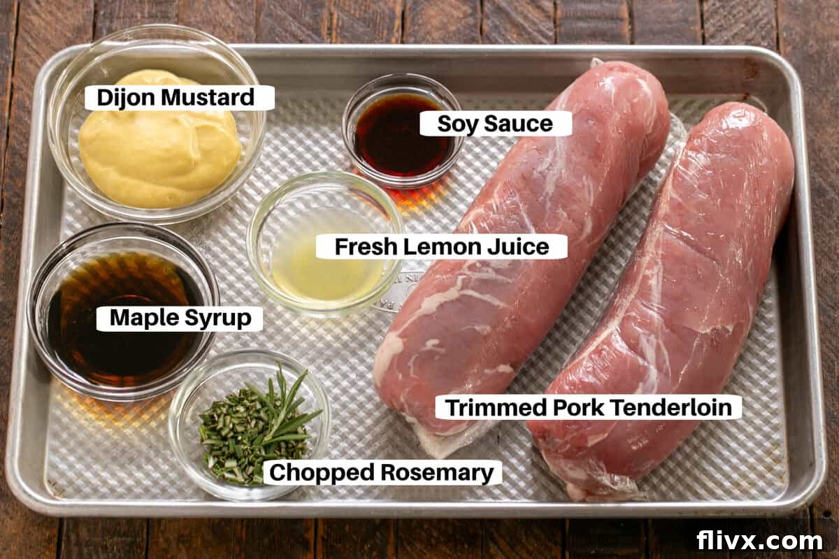 A visual guide showing all the fresh ingredients for Maple Grilled Pork Tenderloin laid out on a metal sheet pan, labeled for clarity.