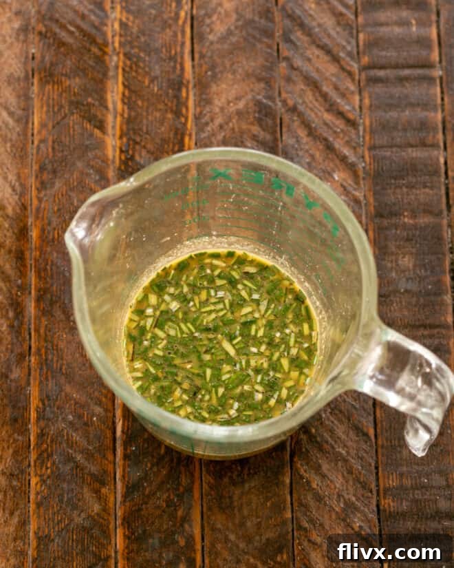 Bowl with all marinade ingredients being mixed together before adding pork.