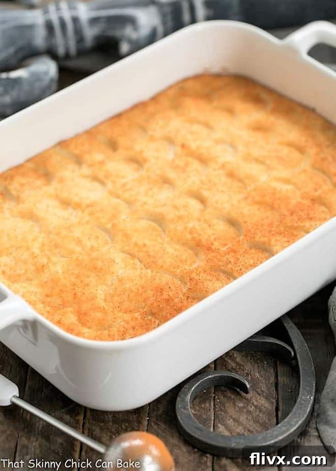 Easy Puffed Potatoes Casserole in a rectangular ceramic baking dish, ready to serve.