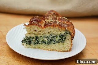 A perfectly golden slice of Italian Spinach Tart on a white plate, highlighting its comforting and delicious nature.