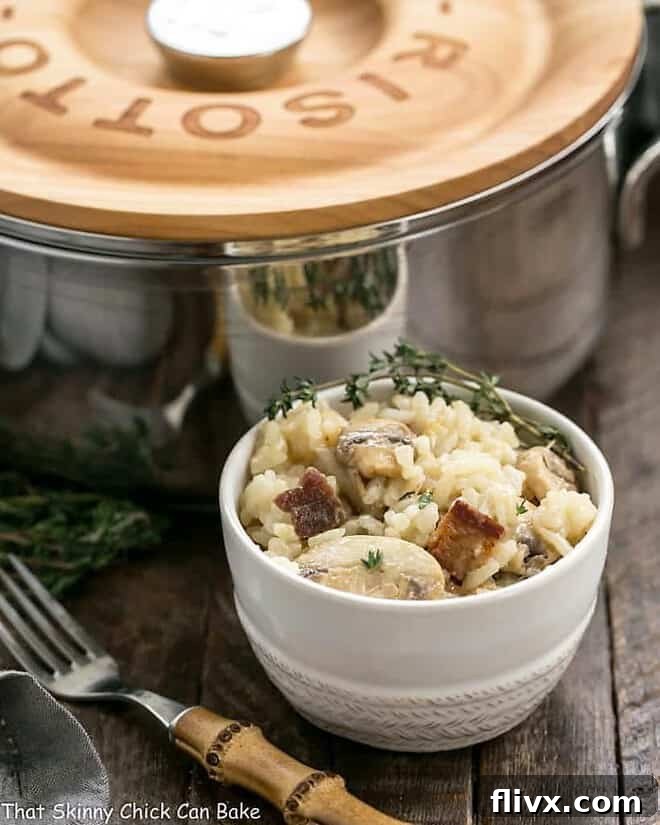 A perfectly portioned bowl of Bacon Mushroom Risotto with Caramelized Onions, garnished with fresh thyme. The rich, creamy texture and vibrant ingredients are visible, inviting a delightful dining experience.