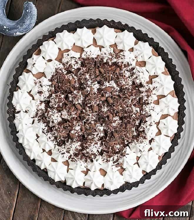 Decadent French Silk Tart with an Oreo crust, garnished with chocolate shavings, ready to be served.