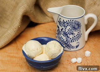 3 scoops of marshmallow ice cream in a blue bowl