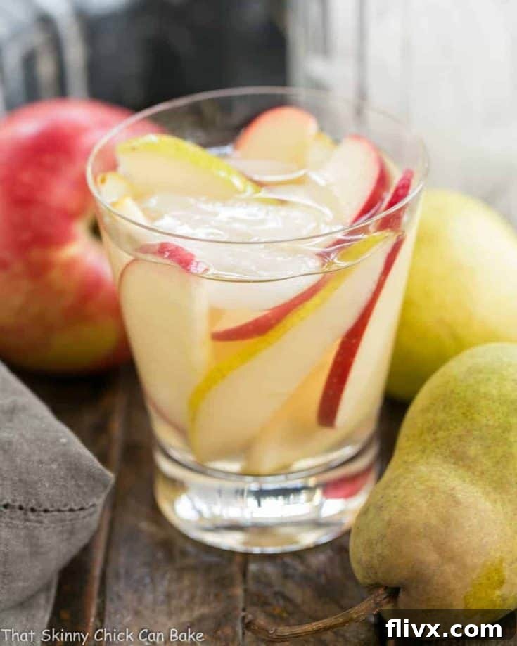 Apple Cider Sangria | An autumnal white wine sangria flavored with cider and pear brandy!