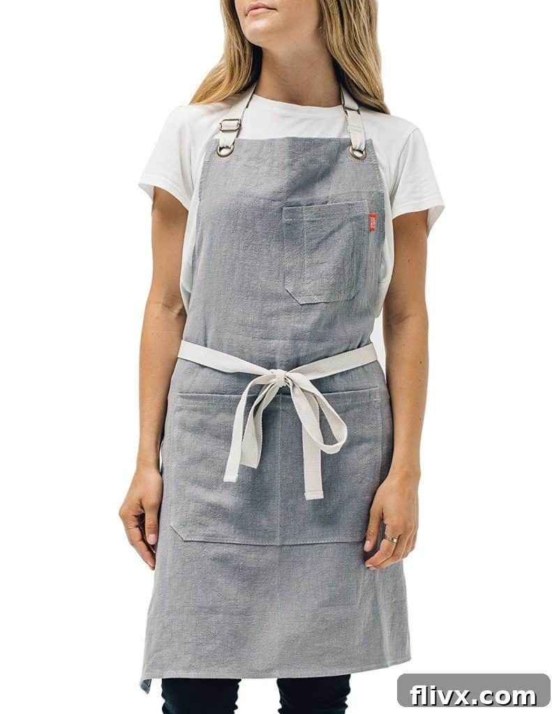 Stylish gray linen apron, providing protection and a professional look in the kitchen.