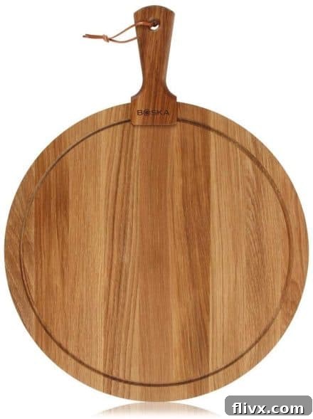 Bosca Round Wooden Cheese Board, an elegant base for charcuterie.