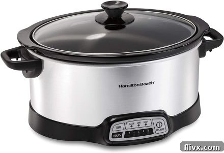 Silver Hamilton Beach Slow Cooker with black handles, a perfect tool for hands-off cooking.