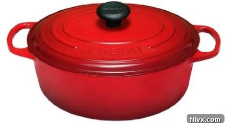Red Le Creuset Dutch Oven with lid, a versatile and beautiful piece of cookware.