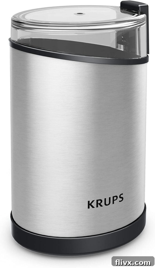 Krups silver electric coffee and spice grinder, essential for fresh flavors.