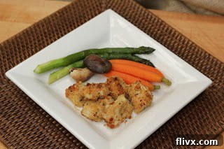 Overhead view of Crispy Baked Chicken Nuggets served with vibrant green beans and carrots