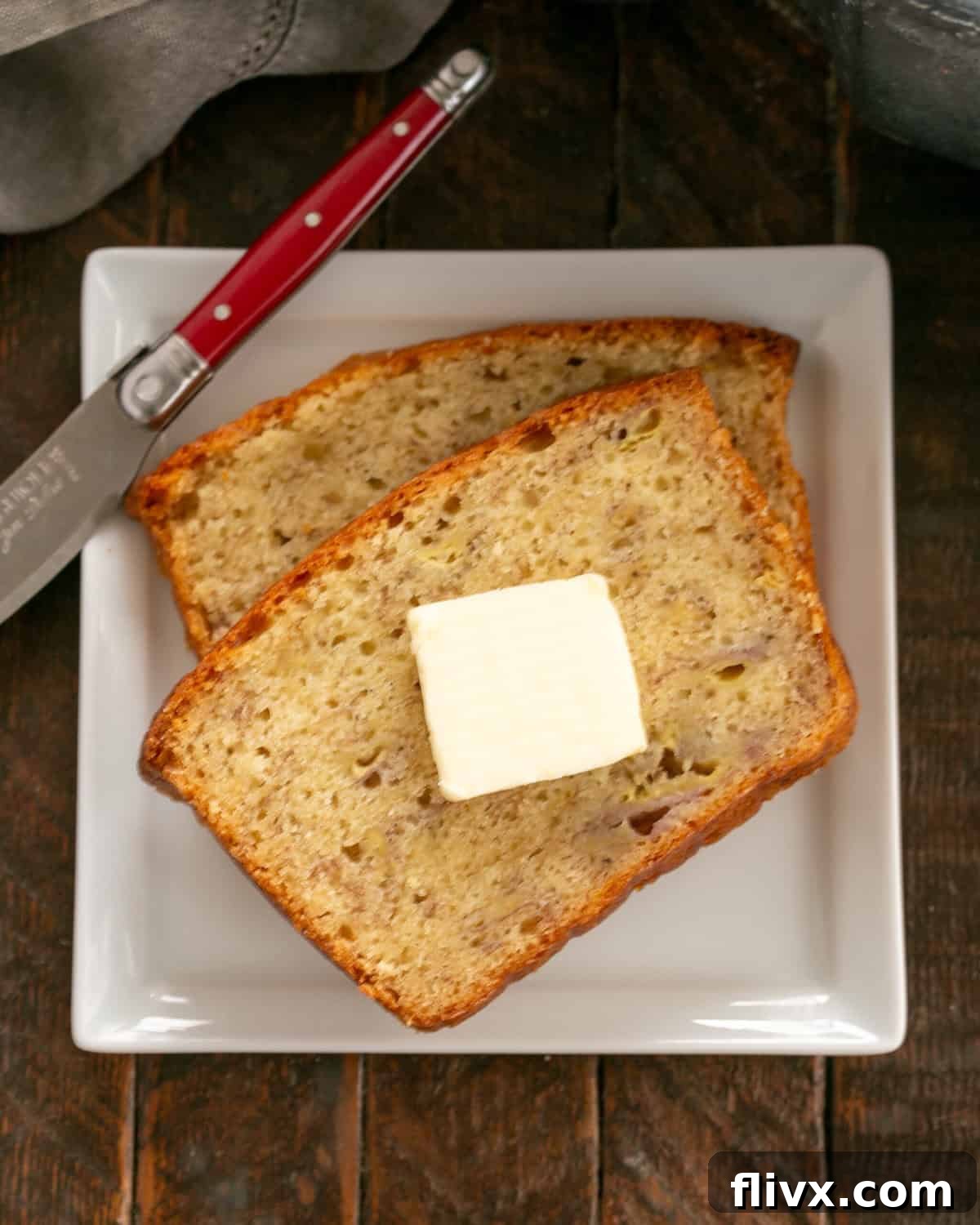 Step 7: A freshly baked loaf of Buttermilk Banana Bread cooling on a wire rack.