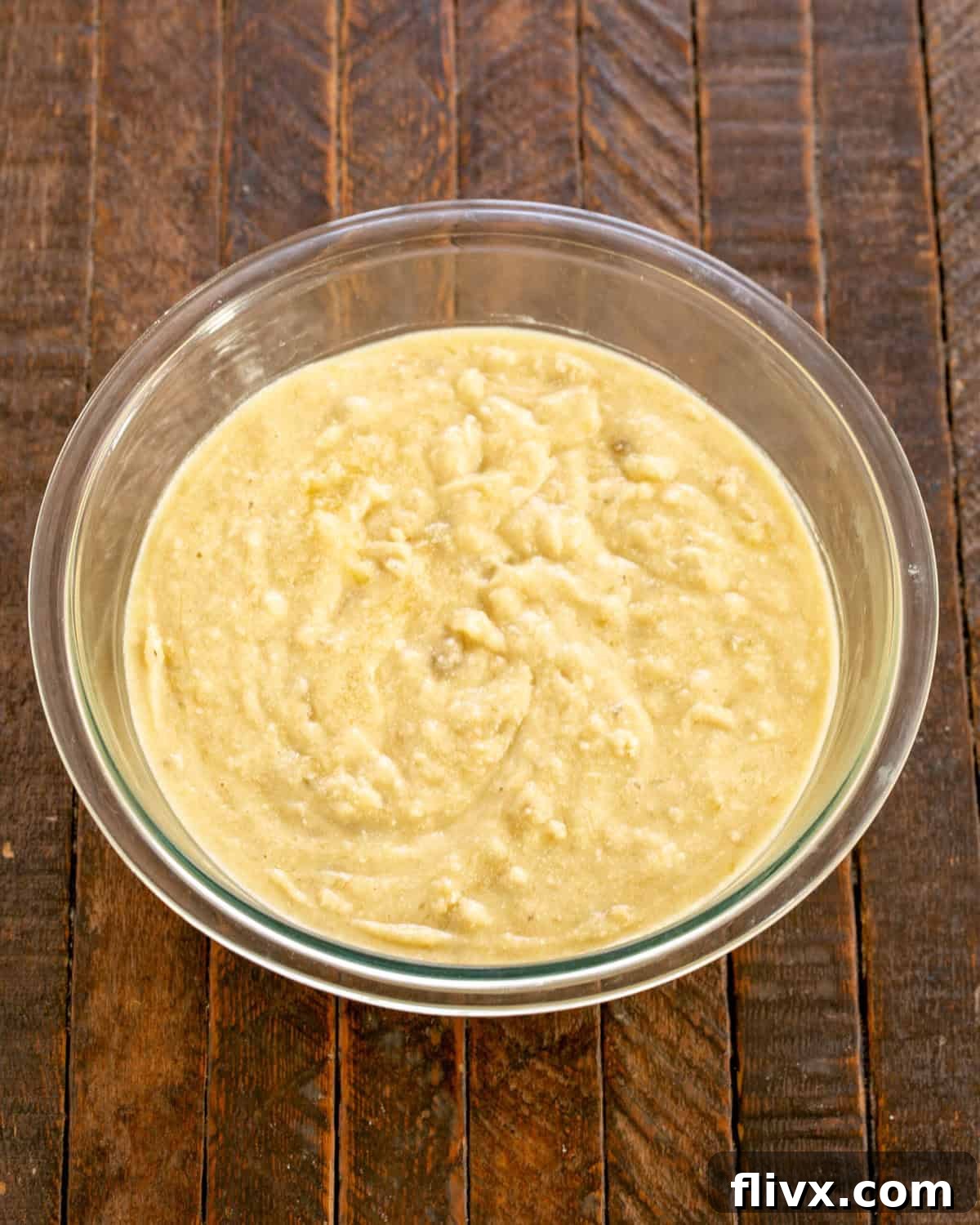 Step 4: Dry ingredients (flour, baking powder, baking soda, salt) being whisked together in a separate bowl.