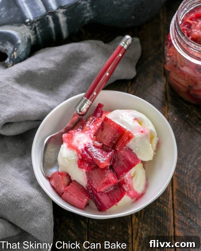 Roasted Rhubarb compote served over scoops of creamy vanilla ice cream, garnished for a fresh and inviting dessert.