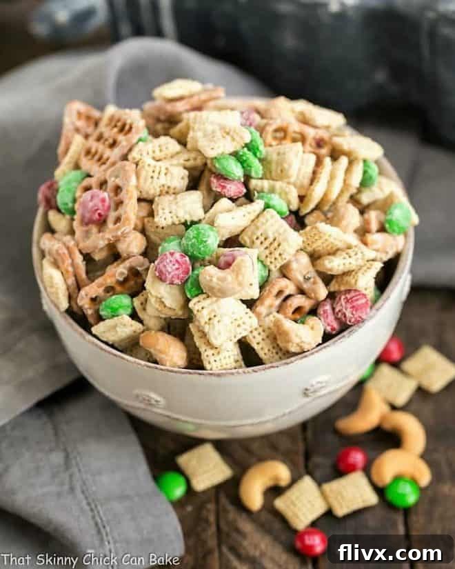 A beautifully presented bowl of festive White Chocolate Cashew Party Mix, ready to be enjoyed at a holiday party