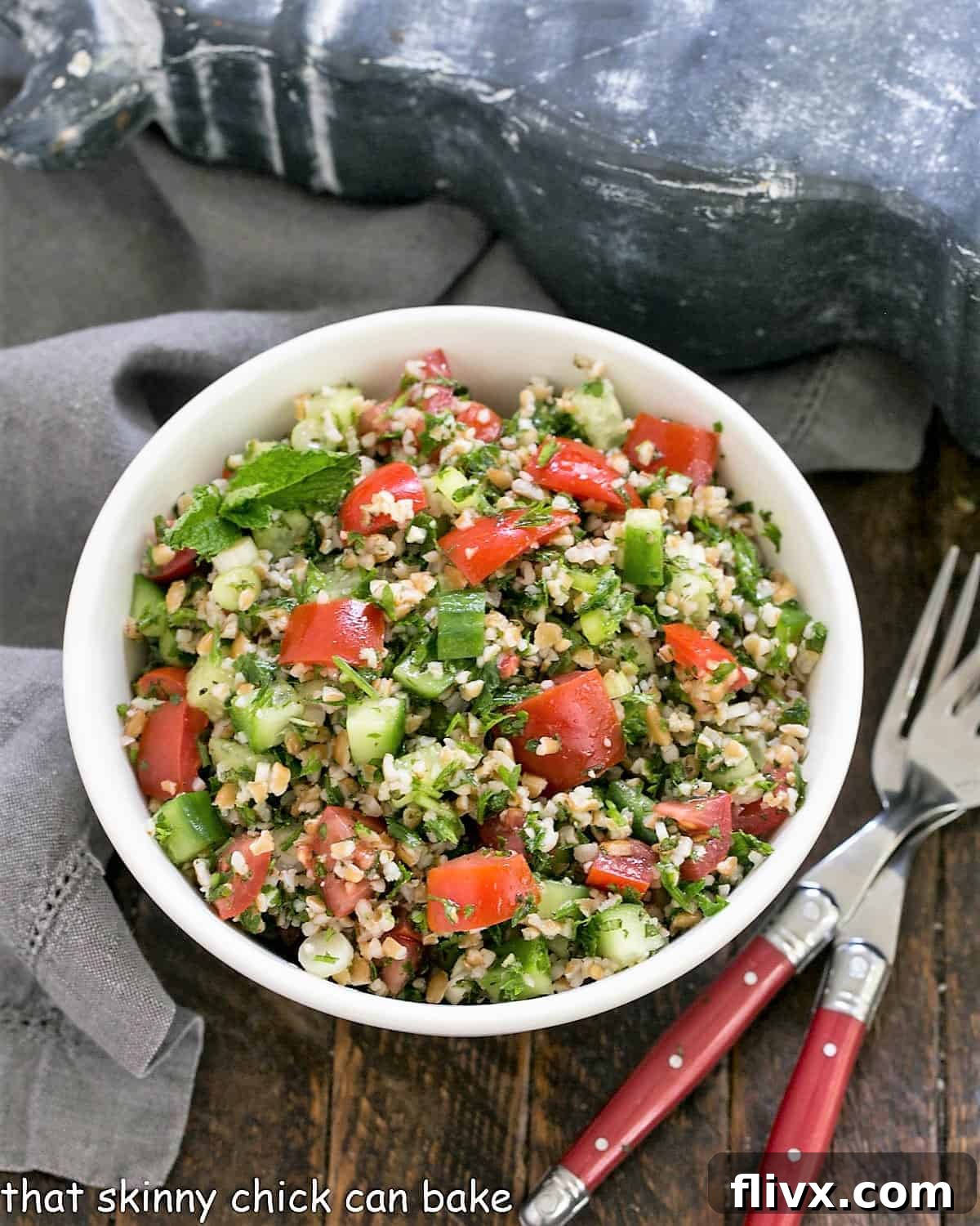 Overhead view Tabbouleh in a white serving bowl.