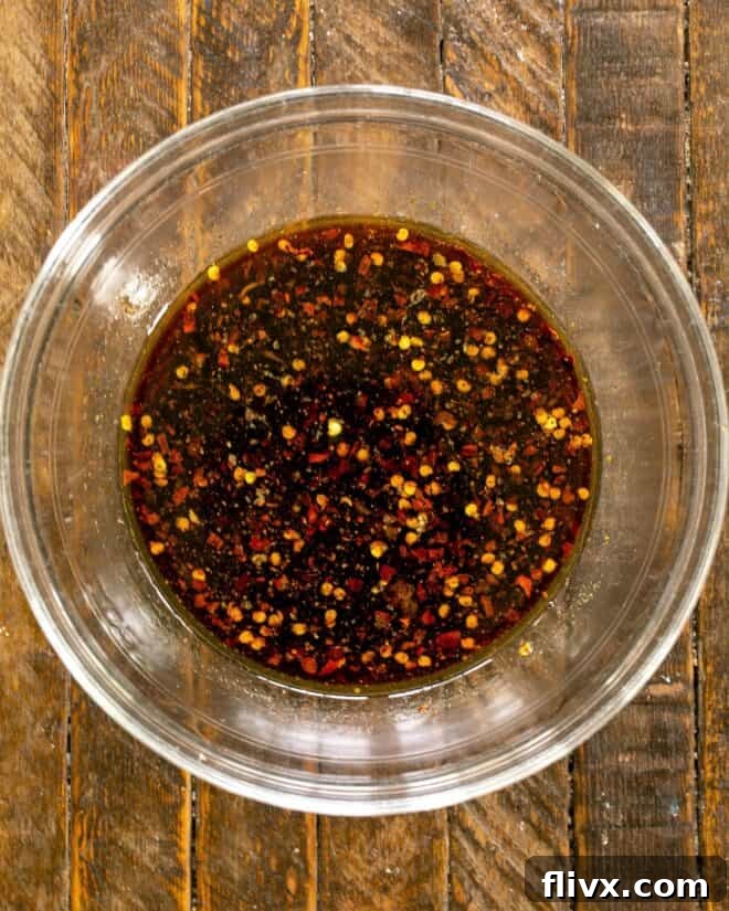 Bulgogi Marinade in a bowl with pork slices, ready for marination.