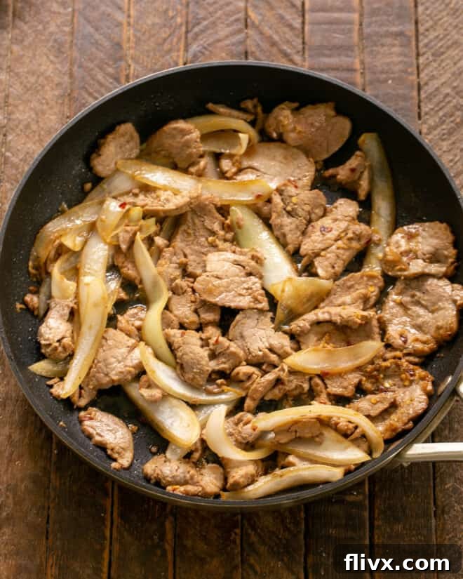 Sauteed Bulgogi in a skillet, showcasing the caramelized meat and onions.