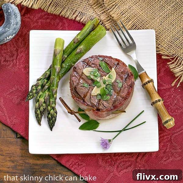 Perfectly cooked Beef Tenderloin Filets with garlic butter and fresh herbs, ready to serve for a special occasion.
