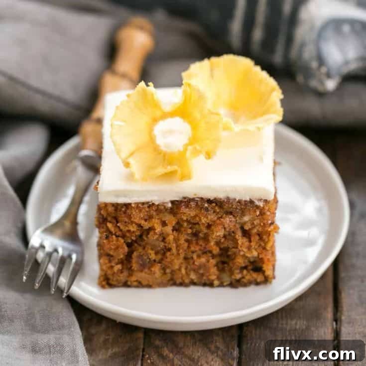 Old Fashioned Carrot Cake with Pineapple Flowers | A dreamy, loaded carrot cake with cream cheese frosting and a beautiful pineapple garnish