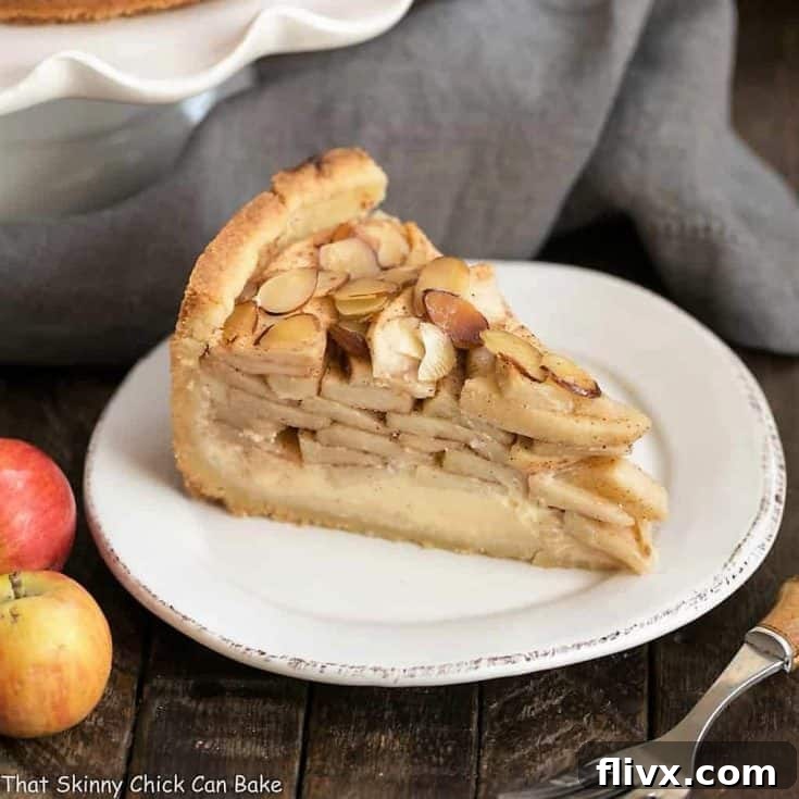 Cream Cheese Apple Torte on a round white dessert plate