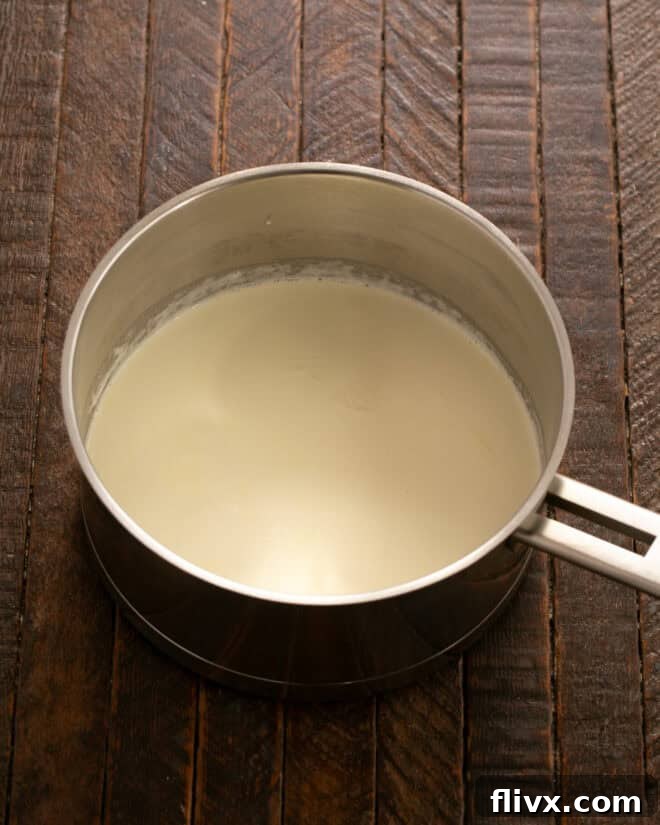 Bring heavy cream to a simmer in a saucepan.