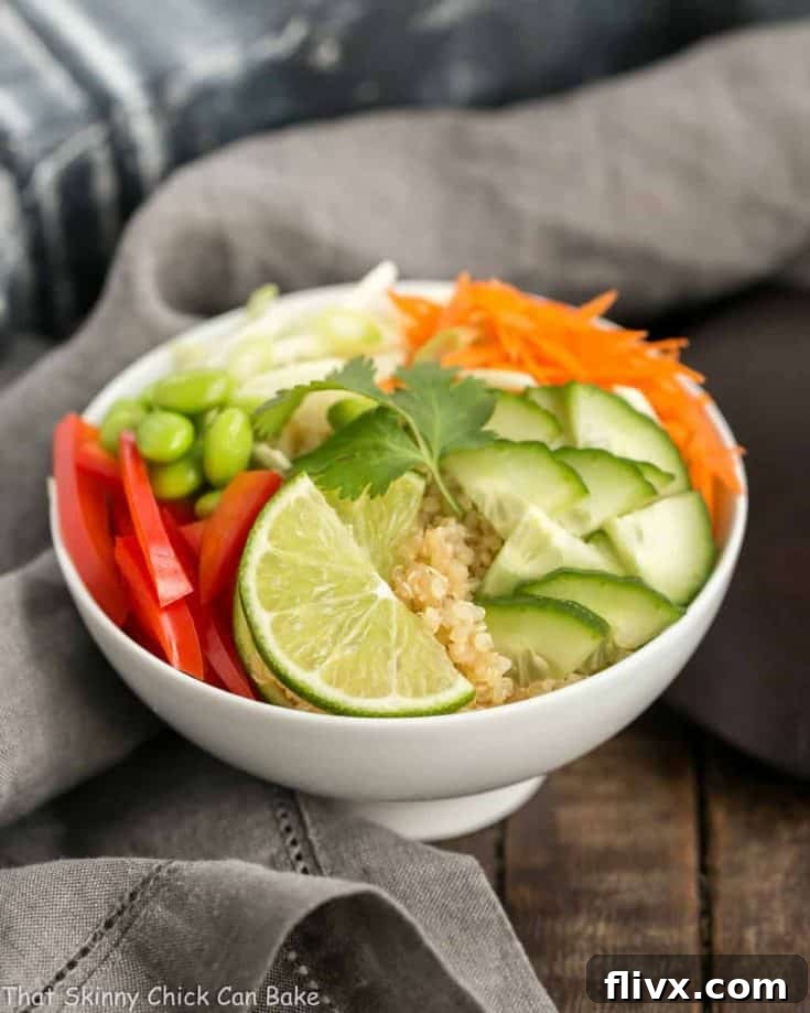 A close-up of a prepared Thai Vegetable Quinoa Bowl, ready to be served.