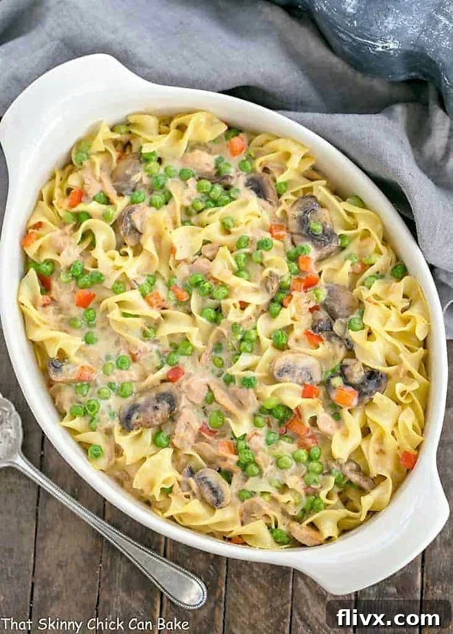 Tuna Noodle Casserole from Scratch in an oval white casserole dish, perfectly golden and bubbly.