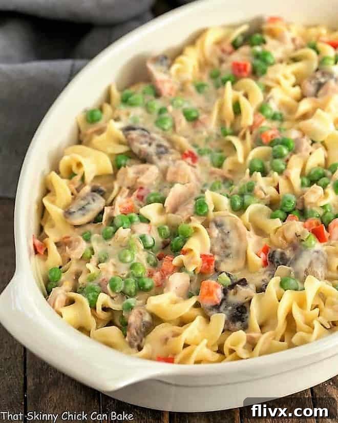 Close-up view of a serving of Tuna Noodle Casserole from Scratch, showing its creamy texture and fresh ingredients.