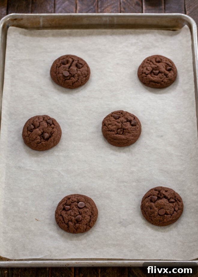 Garnishing with more chocolate chips while warm.