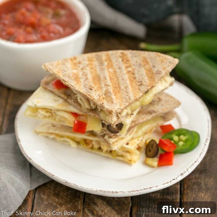 Cheesy Chipotle Chicken Quesadillas on round plate.