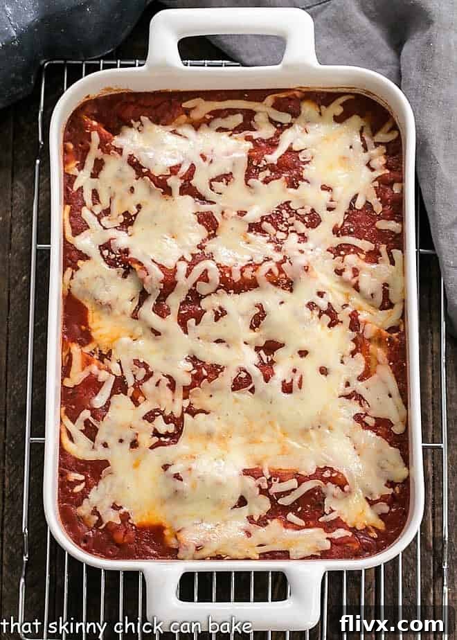 Overhead view of 3 cheese manicotti in a casserole dish.